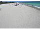 Panoramic beach view with sunbathers enjoying the clear ocean water at 1060 Cockrill St # 1060, Venice, FL 34285