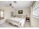 Inviting bedroom with neutral tones, natural light, and a comfortable bed at 1060 Cockrill St # 1060, Venice, FL 34285
