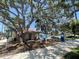 View of Centennial Park with shady trees, a historical marker, and a pathway at 1060 Cockrill St # 1060, Venice, FL 34285