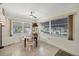 Cozy dining area with natural light, ceiling fan, and views of the outdoors at 1060 Cockrill St # 1060, Venice, FL 34285