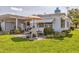 Charming exterior of the home showcasing the patio and carport at 1060 Cockrill St # 1060, Venice, FL 34285