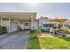 Charming exterior of the home showcasing the patio and carport at 1060 Cockrill St # 1060, Venice, FL 34285