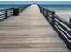 Perspective along the Venice Fishing Pier with wooden planks and ocean views at 1060 Cockrill St # 1060, Venice, FL 34285
