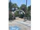 View of the Venice Fishing Pier entrance, surrounded by lush landscaping at 1060 Cockrill St # 1060, Venice, FL 34285