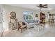 Spacious living room boasting tile floors, comfortable seating, and direct access to the dining area at 1060 Cockrill St # 1060, Venice, FL 34285