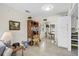 Open-concept layout of the living room and dining area, featuring tile flooring and a cohesive design at 1060 Cockrill St # 1060, Venice, FL 34285