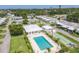 Community pool and shuffleboard courts amidst lush greenery offering a serene recreational space at 1060 Cockrill St # 1060, Venice, FL 34285