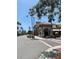 Street view of restaurants on a sunny day in Venice Florida with palm trees at 1060 Cockrill St # 1060, Venice, FL 34285