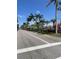 Street view of buildings and palm trees on a sunny day in Venice Florida at 1060 Cockrill St # 1060, Venice, FL 34285