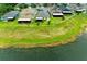 Aerial view of houses and green lawn in a nice community located next to a lake at 10609 Great Cormorant Dr, Riverview, FL 33579