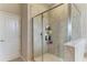 Modern bathroom featuring a glass-enclosed shower with tiled walls, and sleek fixtures for a spa-like feel at 10609 Great Cormorant Dr, Riverview, FL 33579