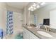 Bathroom featuring dual sinks, granite countertop, tub and shower combo at 10609 Great Cormorant Dr, Riverview, FL 33579