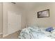 Carpeted bedroom with closet, picture and dresser at 10609 Great Cormorant Dr, Riverview, FL 33579