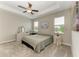 Calm bedroom with tray ceiling, plush carpeting, and natural light creating a peaceful retreat at 10609 Great Cormorant Dr, Riverview, FL 33579
