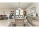Open dining room featuring a neutral color palette, decorative wall art, and a decorative grandfather clock at 10609 Great Cormorant Dr, Riverview, FL 33579