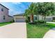 Inviting single-Gathering home featuring well-maintained landscaping and a spacious driveway at 10609 Great Cormorant Dr, Riverview, FL 33579
