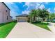 Attractive single-Gathering home with lush green lawn and a spacious driveway leading to a two-car garage at 10609 Great Cormorant Dr, Riverview, FL 33579
