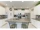 Bright kitchen features granite counters, stainless steel appliances, and a central island with seating at 10609 Great Cormorant Dr, Riverview, FL 33579