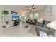 Cozy living room with tile flooring, neutral paint, lots of natural light and comfortable seating at 10609 Great Cormorant Dr, Riverview, FL 33579