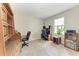 Home office with built-in shelving, desk, and natural light at 10609 Great Cormorant Dr, Riverview, FL 33579