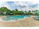 Resort-style outdoor pool with comfortable lounge chairs and umbrellas for relaxation and shade at 10609 Great Cormorant Dr, Riverview, FL 33579