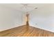 Clean and airy bedroom featuring modern flooring and an open doorway at 1144 Hoover St, Nokomis, FL 34275