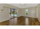 Bedroom with sliding door access to the pool and a bright window at 1144 Hoover St, Nokomis, FL 34275