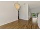 Light dining area with wood-look tile floors and access to the outdoor pool area at 1144 Hoover St, Nokomis, FL 34275