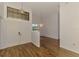 Open foyer with double doors, decorative lighting, and wood-look tile flooring, creating an inviting entrance at 1144 Hoover St, Nokomis, FL 34275