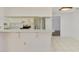 Clean kitchen featuring white cabinets, stainless steel appliances, and a breakfast bar at 1144 Hoover St, Nokomis, FL 34275