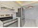 Updated kitchen featuring modern appliances, white cabinetry, and open space at 1144 Hoover St, Nokomis, FL 34275