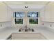 Kitchen sink area offering ample natural light and peaceful outdoor view at 1144 Hoover St, Nokomis, FL 34275