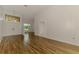 Bright, open living room with modern tile flooring, high ceilings, and chandeliers, creating a spacious feel at 1144 Hoover St, Nokomis, FL 34275