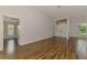 Open-concept living area with wood-look tile floors, high ceilings, and an abundance of natural light at 1144 Hoover St, Nokomis, FL 34275