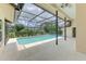 Screened-in pool area with view of the home's exterior at 1144 Hoover St, Nokomis, FL 34275