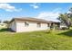 Exterior shot of a single-story home with well-maintained lawn and an enclosed patio area at 1163 Nantucket Rd, Venice, FL 34293