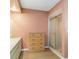 Bathroom with a tiled shower, a wooden dresser, and a white vanity, offering ample storage at 1163 Nantucket Rd, Venice, FL 34293