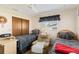 Cozy bedroom featuring two twin beds, a ceiling fan, and a window with a valance at 1163 Nantucket Rd, Venice, FL 34293