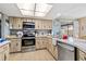 Well-equipped kitchen with stainless steel appliances, wooden cabinets, and lots of counter space at 1163 Nantucket Rd, Venice, FL 34293