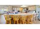 Open kitchen featuring stainless steel appliances, lots of counter space, wood cabinets and a breakfast bar at 1163 Nantucket Rd, Venice, FL 34293