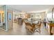 Spacious living room and kitchen featuring a dining area, lots of windows, and neutral colors at 1163 Nantucket Rd, Venice, FL 34293