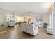 Bright living room with hardwood floors, a ceiling fan and lots of space for relaxing and entertaining at 1163 Nantucket Rd, Venice, FL 34293
