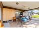 Enclosed patio with tiled floor, ceiling fan and sliding glass doors leading to the interior of the house at 1163 Nantucket Rd, Venice, FL 34293