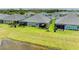 A row of beautiful homes with screened in lanais overlooking a lush green space and pond at 11685 Great Brook Ln, Parrish, FL 34219