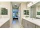 This bathroom features double sinks, a shower, and easy access to the main bedroom at 11685 Great Brook Ln, Parrish, FL 34219