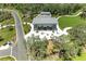 Aerial view of a clubhouse with outdoor seating and manicured landscaping at 11685 Great Brook Ln, Parrish, FL 34219