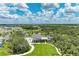 Aerial view showcasing a community with lush greenery, walking trails, and a clubhouse at 11685 Great Brook Ln, Parrish, FL 34219