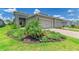 Charming single-story home with well-manicured landscaping and a two-car garage at 11685 Great Brook Ln, Parrish, FL 34219