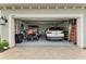 Spacious garage featuring ample parking space, a golf cart, and epoxy flooring at 11685 Great Brook Ln, Parrish, FL 34219