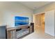 The living room showcases an electric fireplace, a wall-mounted TV, and neutral-colored tile flooring at 11685 Great Brook Ln, Parrish, FL 34219